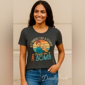 - “Not Fragile Like A Flower Friagile Like A Bomb “Feminist Size Medium